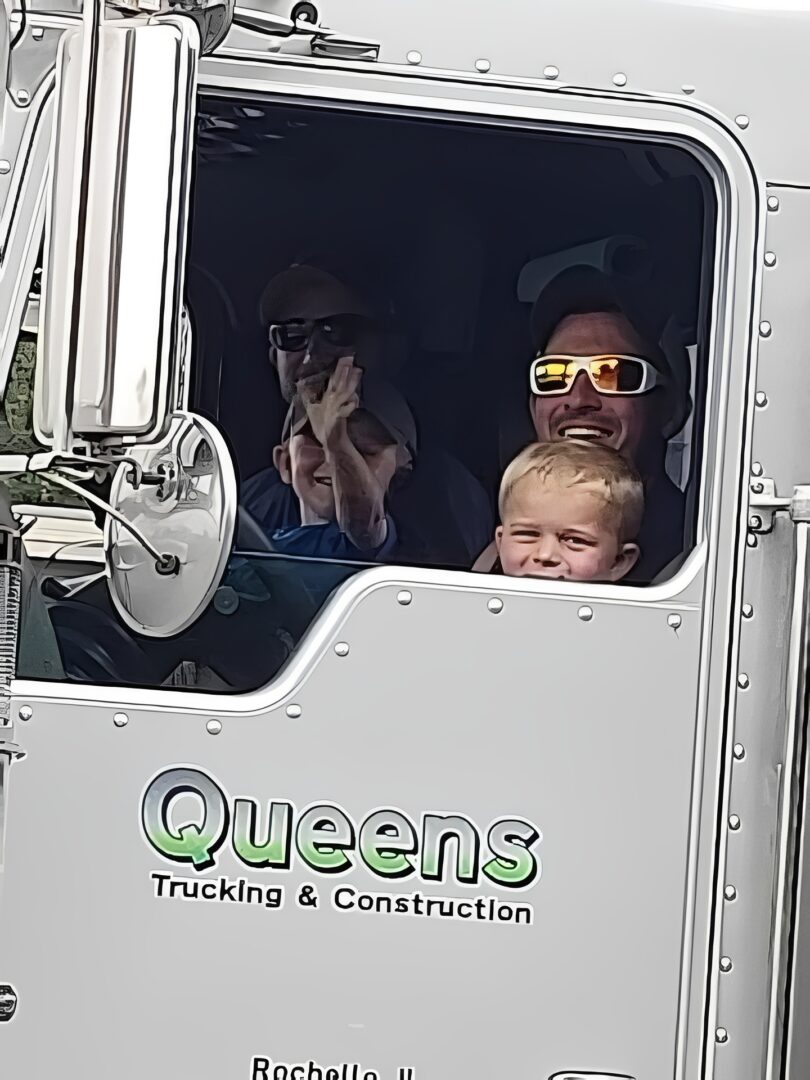 Family inside a truck cabin