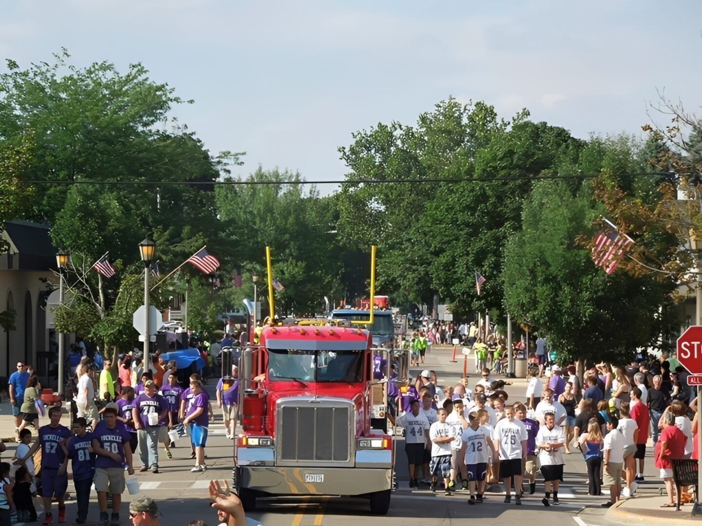 Festive gathering with flags and truck