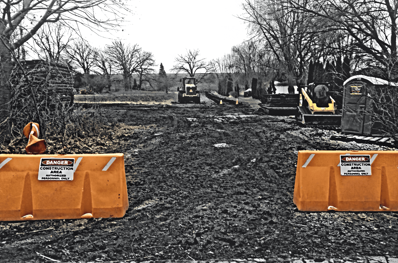 Construction site with barriers and machinery