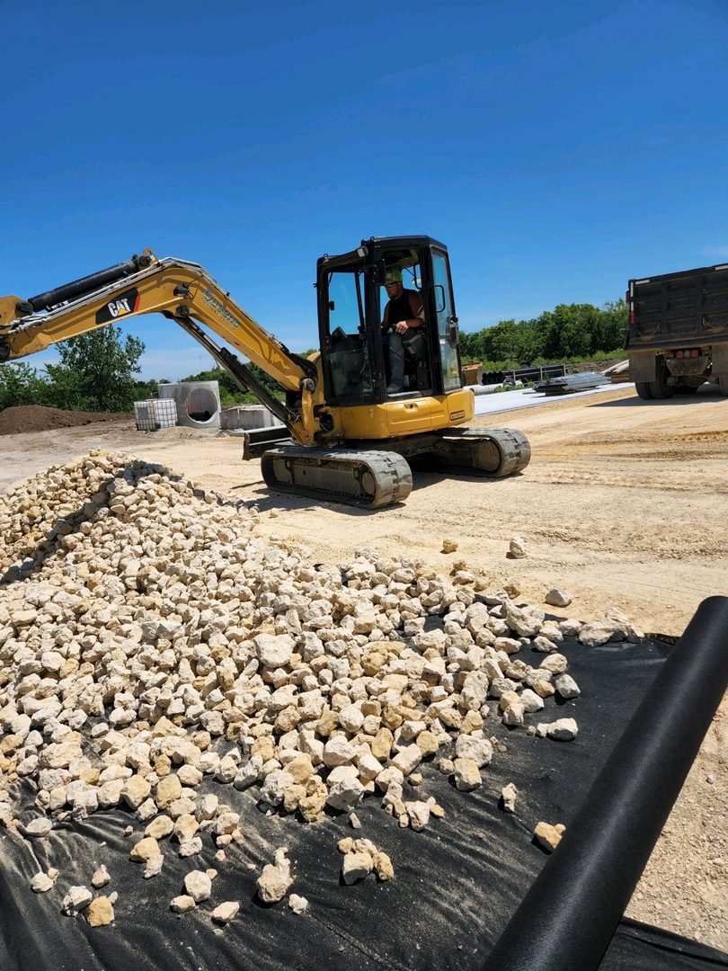 Heavy machinery working on rocky terrain