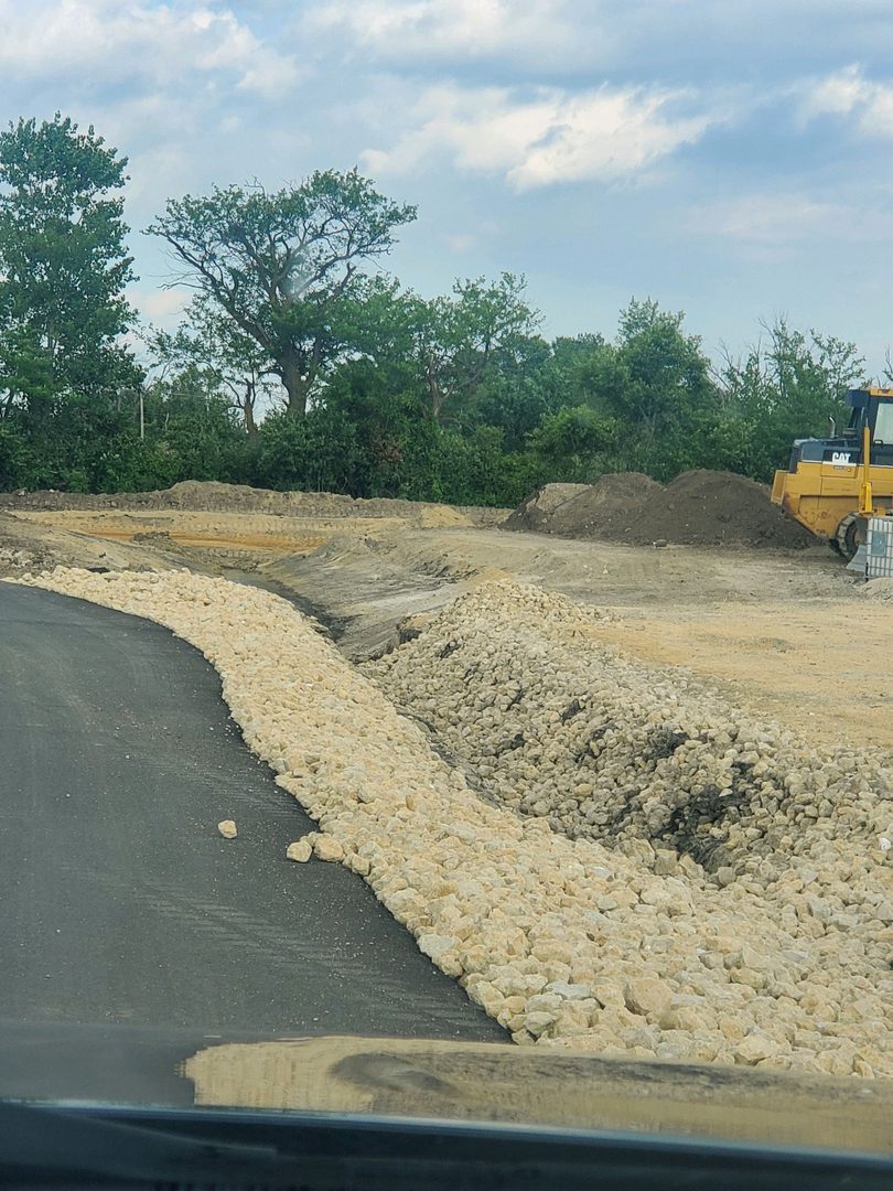 Roadwork with trees in background